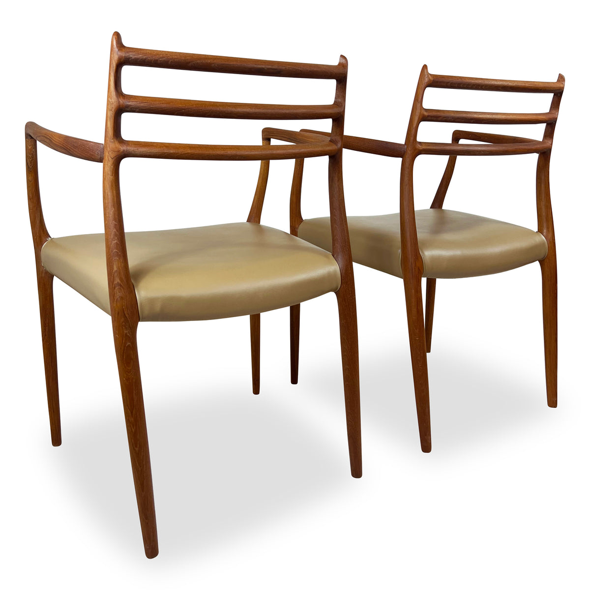 Pair of Moller Model 62 Arm Chairs
